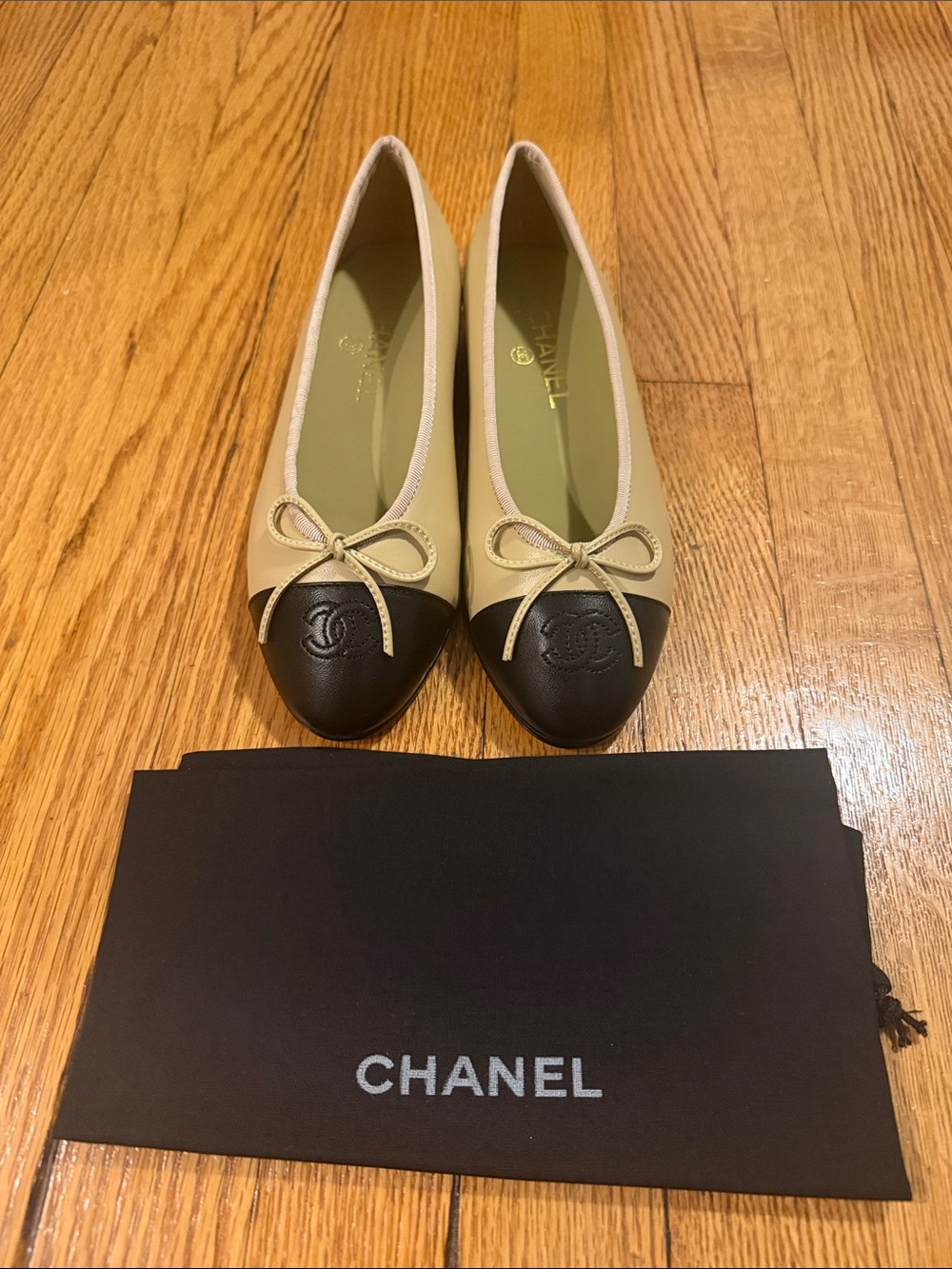CHANEL Beige and Black Cap-Toe Ballet Flats with CC Medallion